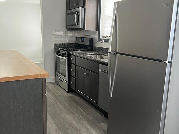 Kitchen showing gas stove, refrigerator, dishwasher and microwave.