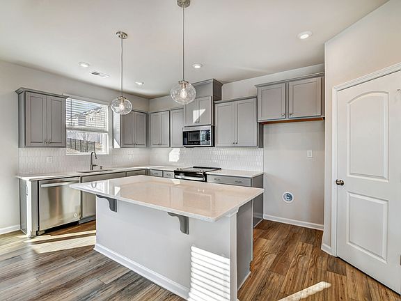 Kitchen with island breakfast bar