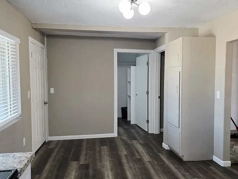 View of dining area and into the master bathroom and linen/closet space