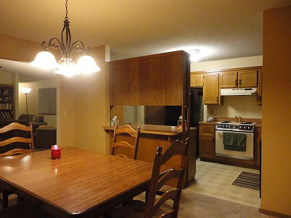 Dining room with view of kitchen. All kitchen appliances remain.