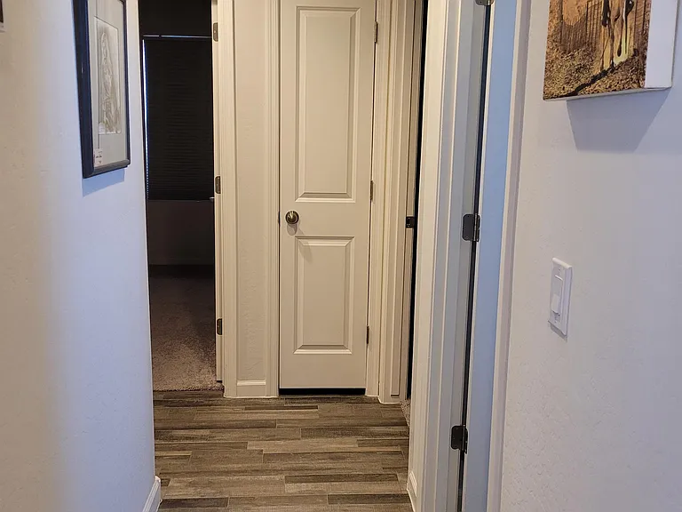 Hallway to bedrooms, bathrooms, and laundry room