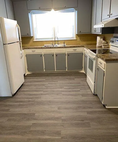 Large eat-in kitchen, lots of cabinets with great storage, double window over sink looking out to front yard/driveway.
