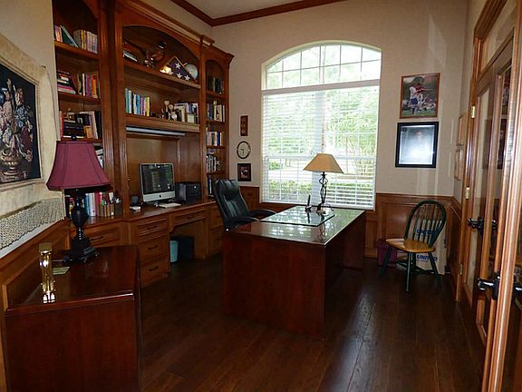Study with Custom Built in Cabinets and Beautiful Hard Wood Floors.
