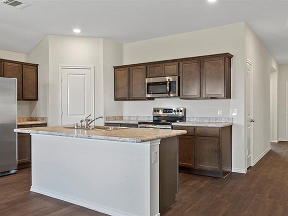 Photos shown here may not depict the specified home & features included are for illustration purposes only