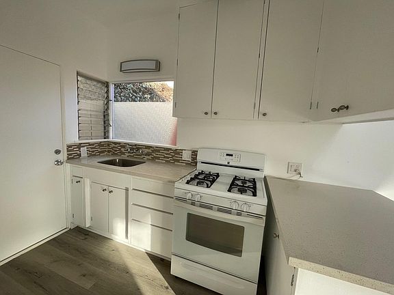 Newly renovated kitchen. Clean, white, brand new.