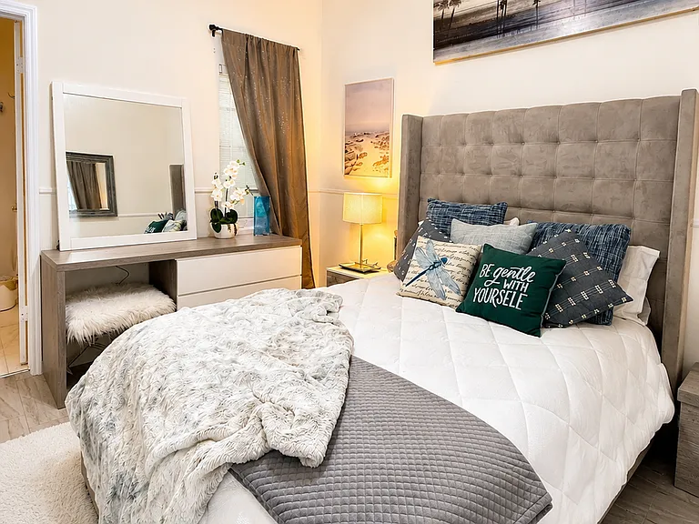 Tempurpedic Mattress and vanity with plenty of space and drawers, blackout curtains.