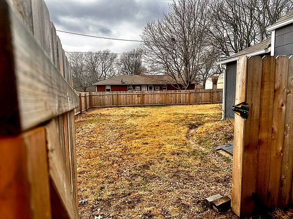 Fenced in backyard with gate