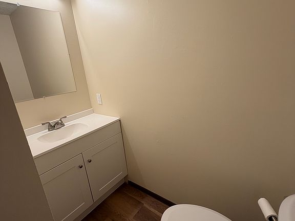 First Floor half bath with new toilet, vanity, light, mirror and fixtures