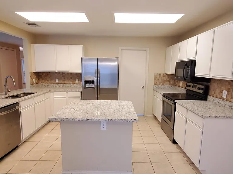 Beautiful granite kitchen with updated fixtures and appliances.