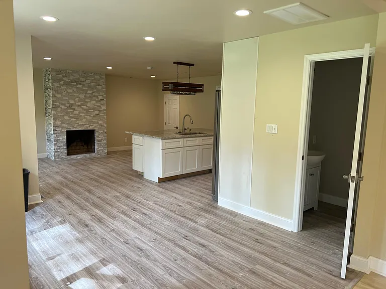 Chef's kitchen with oversized island, stainless appliances, and walk-in pantry _ perfect for cooking and entertaining.