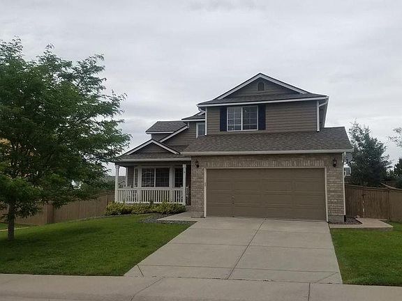 Front of house, 2 car garage,