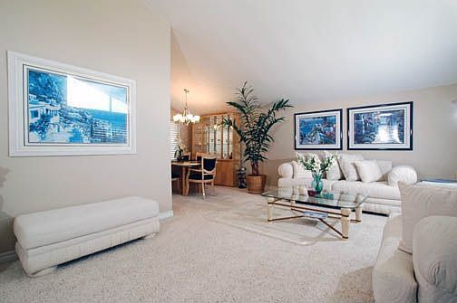 Spacious living room, vaulted ceilings, fresh paint, newer windows throughout 