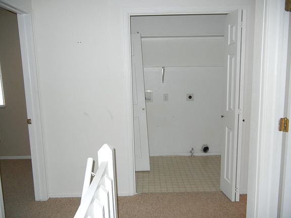 Laundry is upstairs with the bedrooms