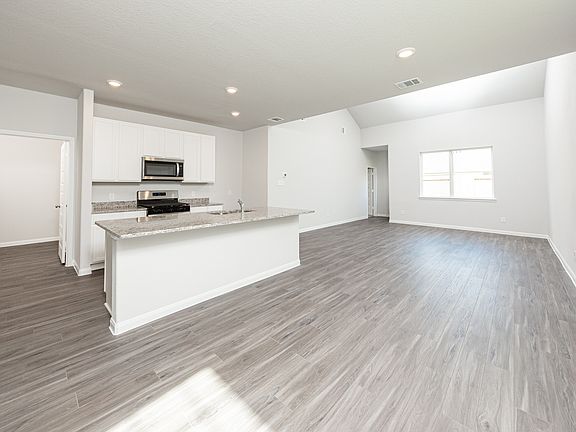 Dining Area to Kitchen and Family Room