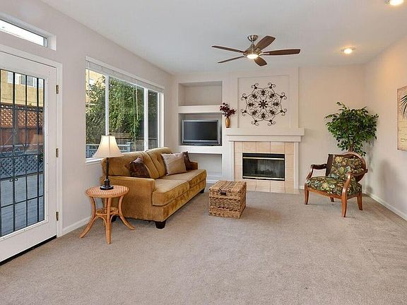 Family room with door leading to large deck