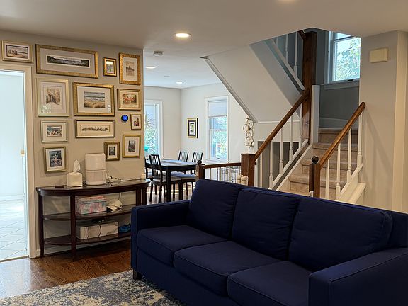 Main level living room and dining room with LED recessed lighting