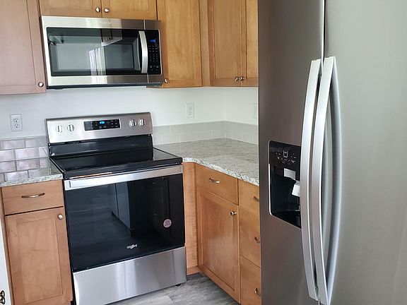 kitchen all new stainless steel with quartz counter tops