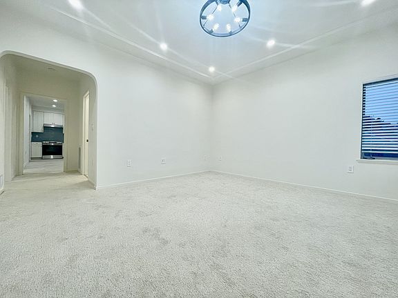Livingroom - recessed ceiling; a picture window and a side window. Both with cordless lift blinds; A center light, 8 dimmable recess lights; pre-wired internet/cable