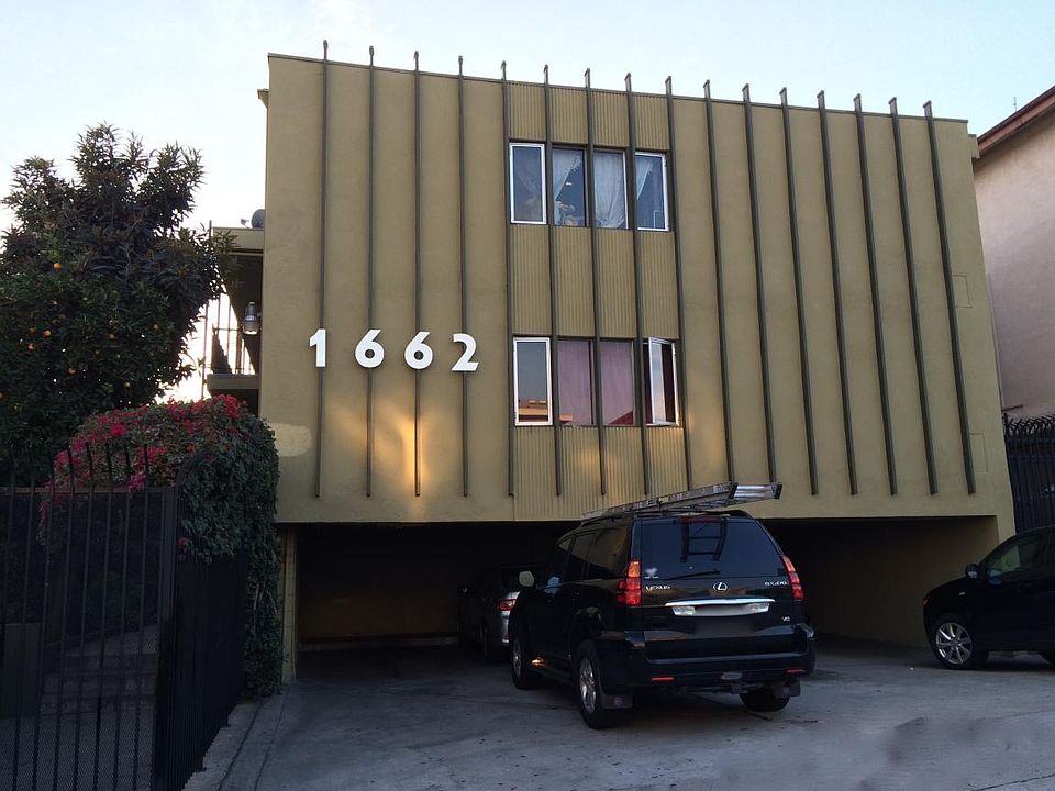 Front view of building featuring parking area.
