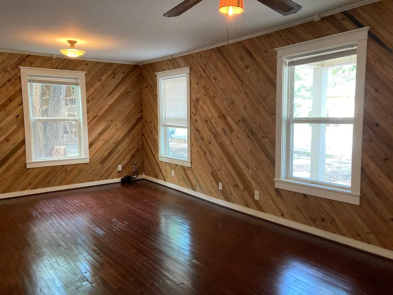Living room with windows facing street