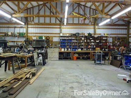 In side shop
						:
						lg shop with concret floor, room for all the toys, 100 amp service