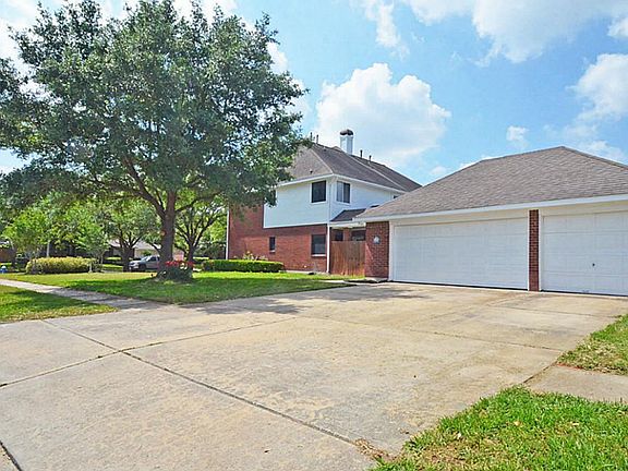 Three car garage with side entrance allows ample room for parking.