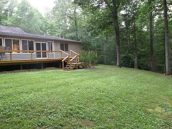 Rear view of yard and deck