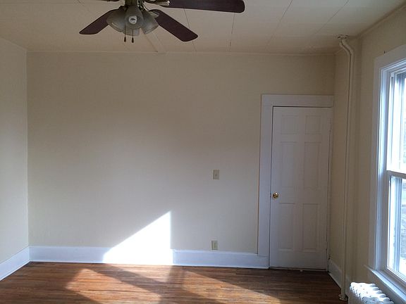 View of Living Room and front door from the Kitchen. (There is no Bedroom.)