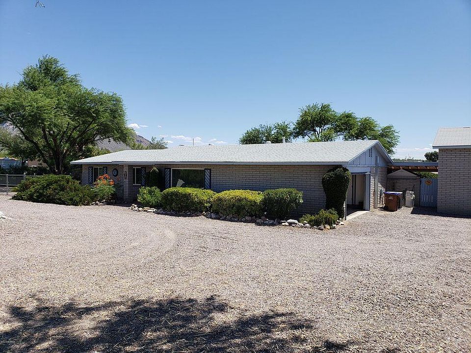 Front of house and circular gravel driveway