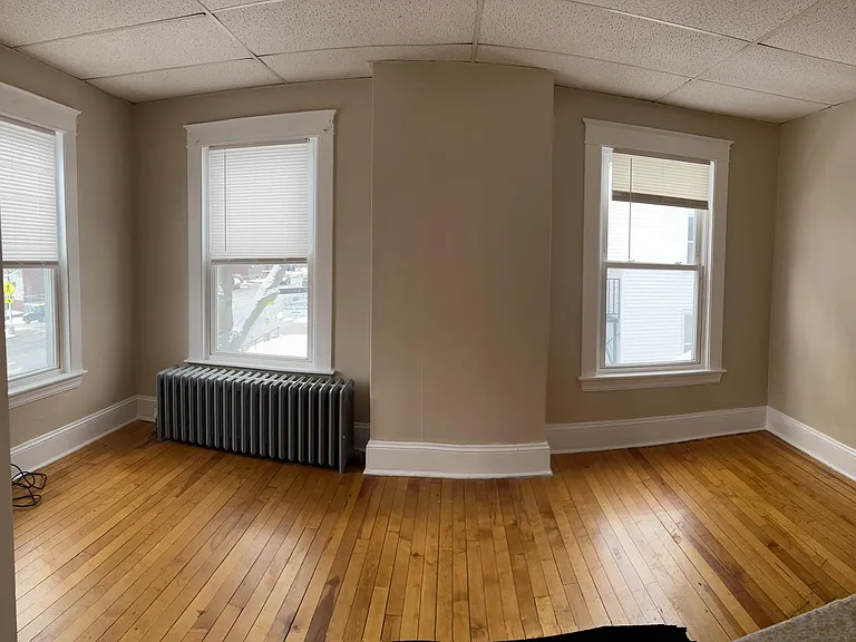 large, sunny rooms with hardwood flooring