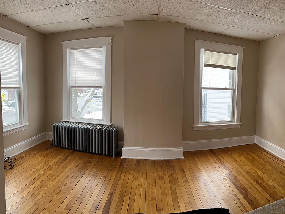 large, sunny rooms with hardwood flooring