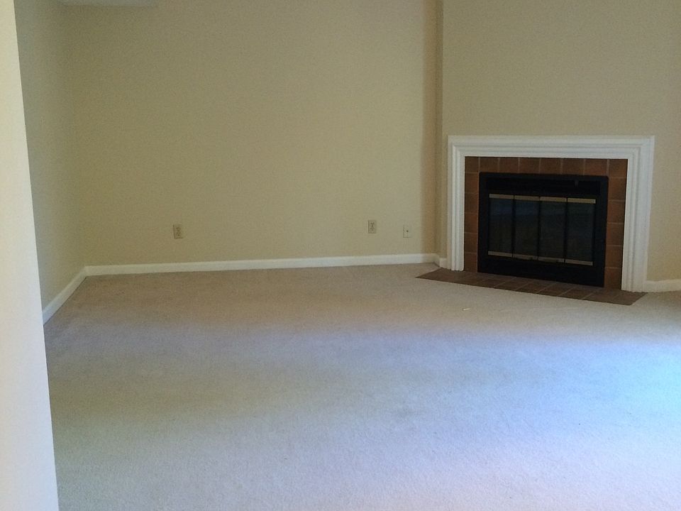 Great room, wood burning fireplace, deck off of room