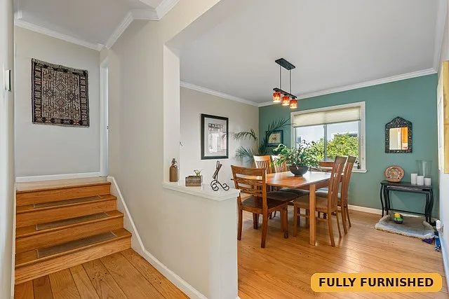 Spacious formal dining room across from the kitchen seats six.