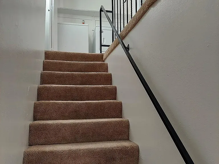 Stairs to laundry, bedrooms and fully bathroom