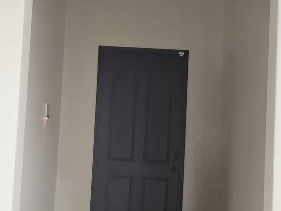 Corridor after entering. Take a right turn at end of corridor towards guest area.