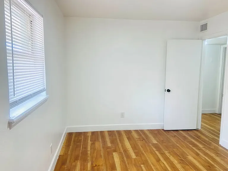 Different angle of bedroom. Look at those floors!!