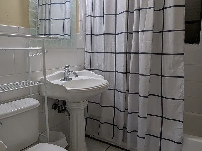 Second bathroom with bath tub.