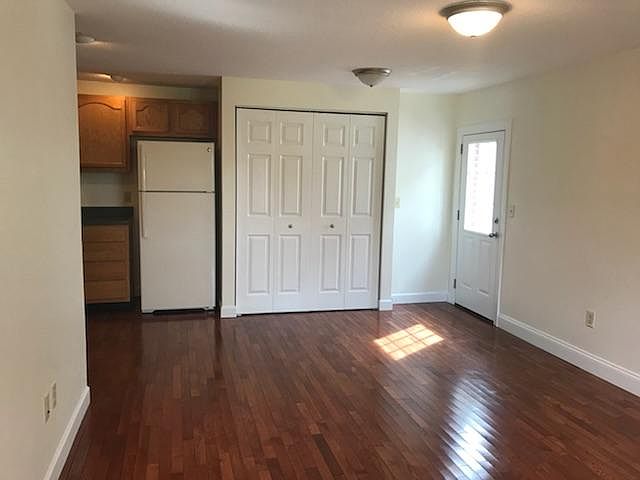 Alternate view of living room; back door visible, right