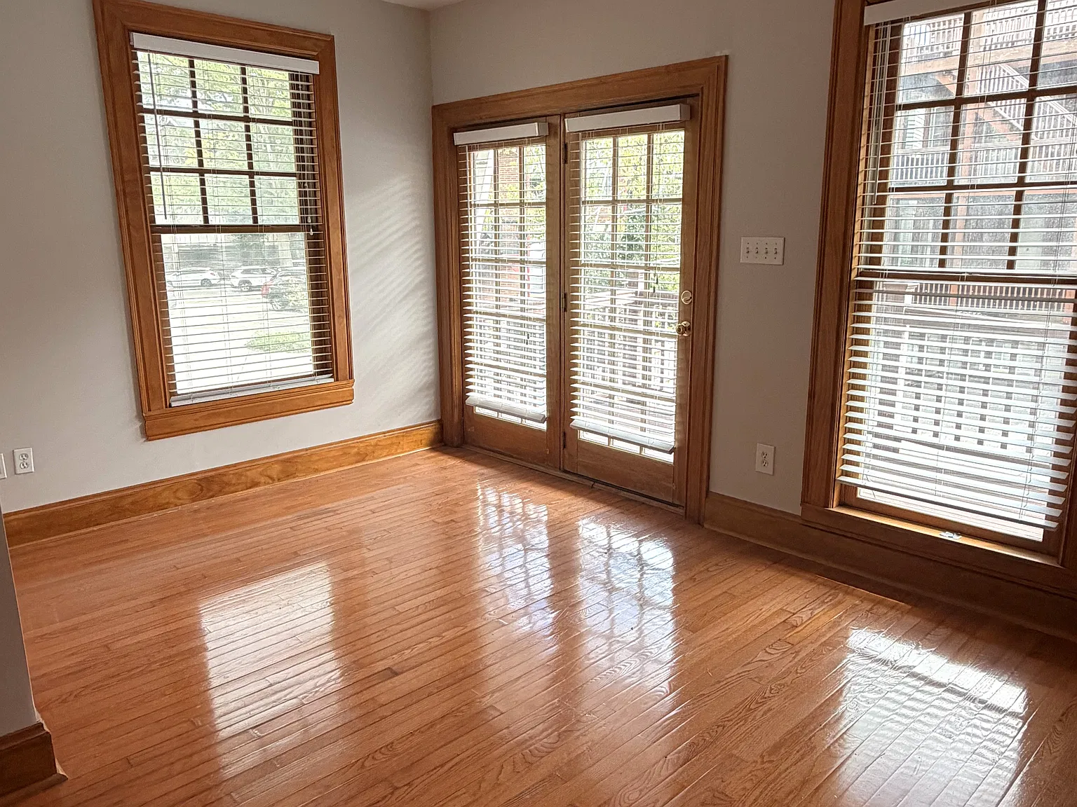 Main Bedroom: Spacious main bedroom featuring beautiful French doors that open directly onto the private balcony, bringing in abundant natural light and offering convenient outdoor access.