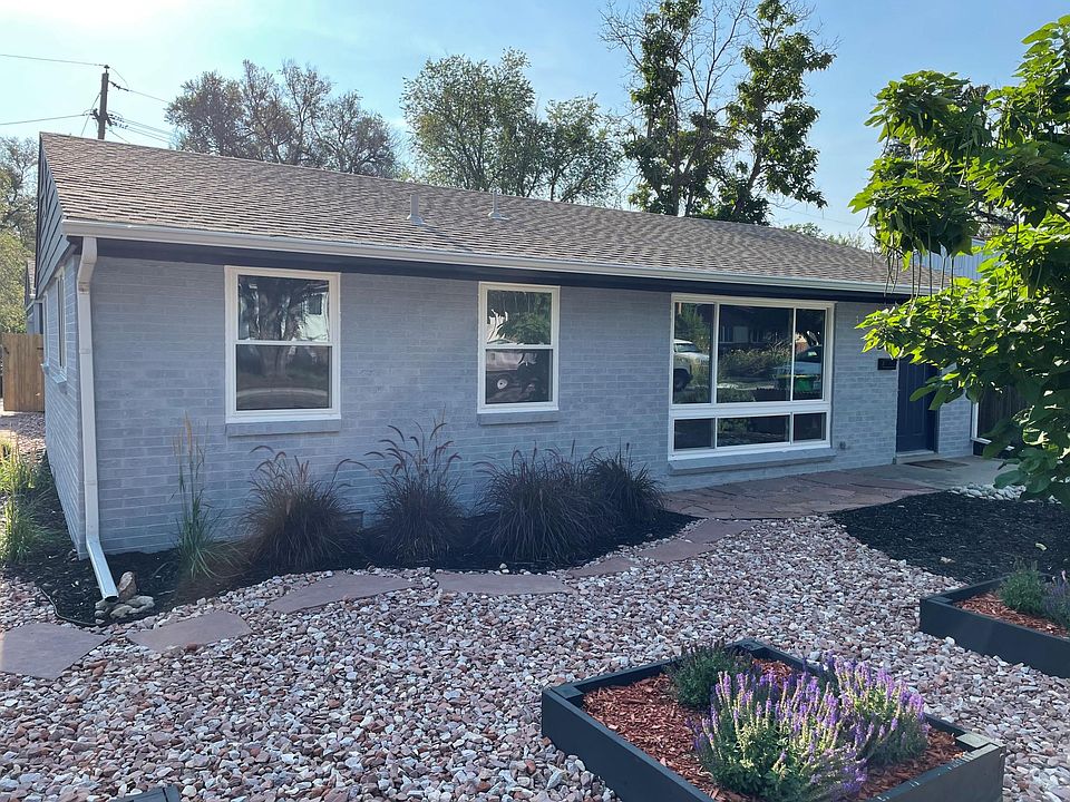 Front, xeriscape yard and new windows