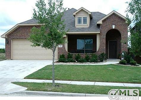 Great curb appeal with large covered front porch, dormer window,