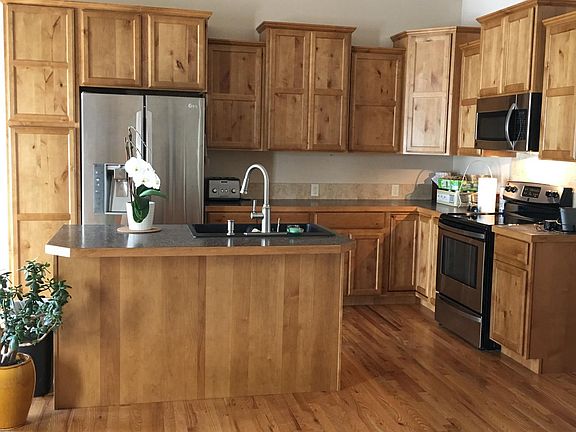 kitchen with hardwood floors and alder cabinets