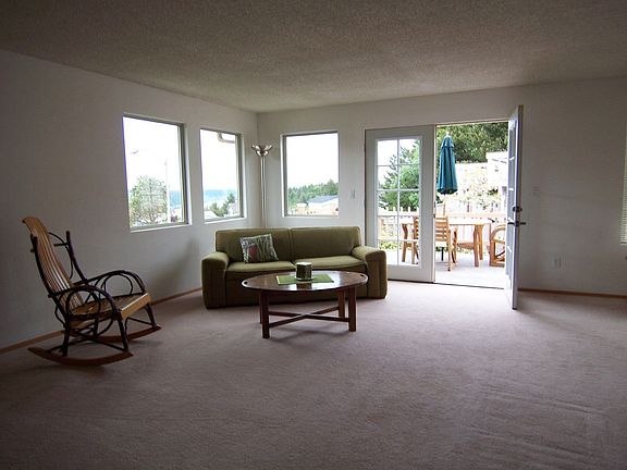 Large living room is open to DR at right