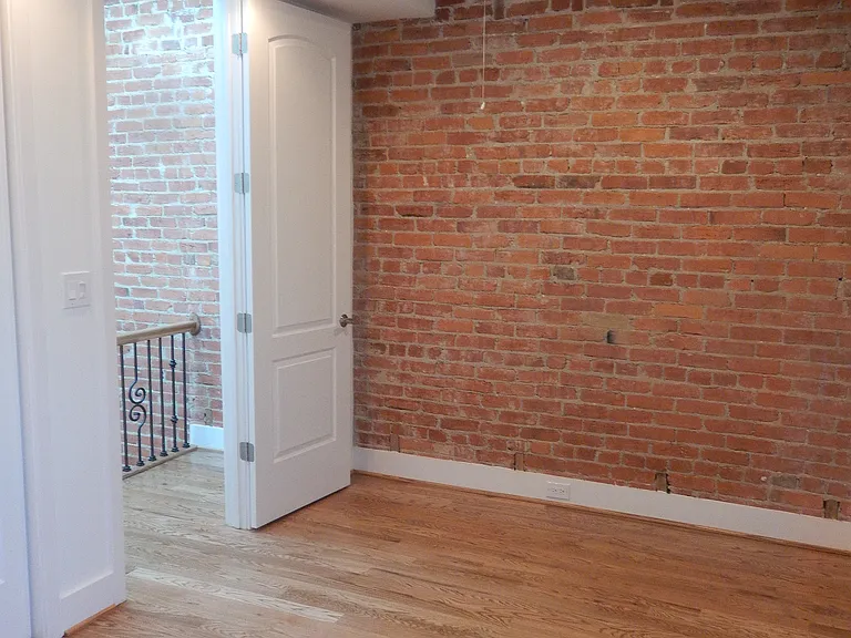 Third floor rear bedroom.