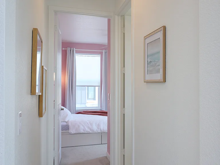 Hallway to bedroom and bathroom.