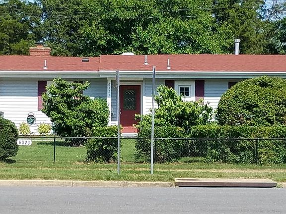 Front of the house with concrete two-car driveway