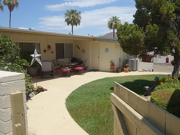 Private backyard with covered patio and private attached sto