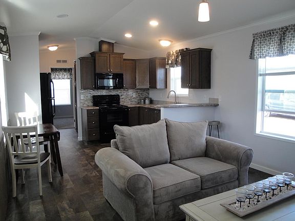 Black appliances included. Electric range, microwave, refrigerator, dishwasher, garbage disposal.