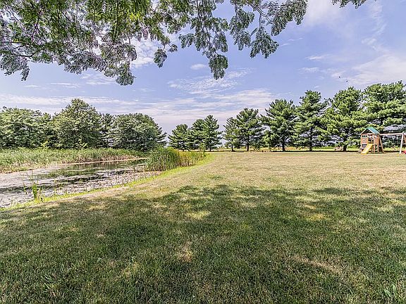 This private back yard is like your own personal park with the pond, pool and swing set. There's a picnic table and poles for a hammock at the far edge of the pond under the shade of the pine trees. This place is paradise