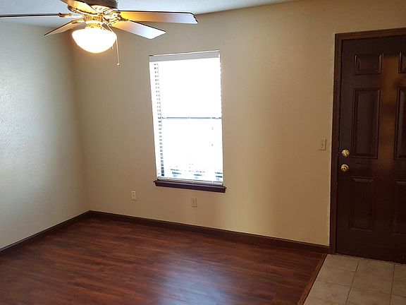 Master Bedroom with walk in closet and door to backyard